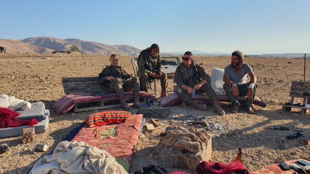 Settlers and soldiers during almurrajat raid